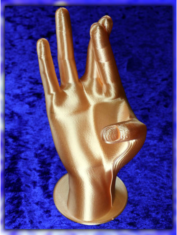 Dekorative Hand in Gold